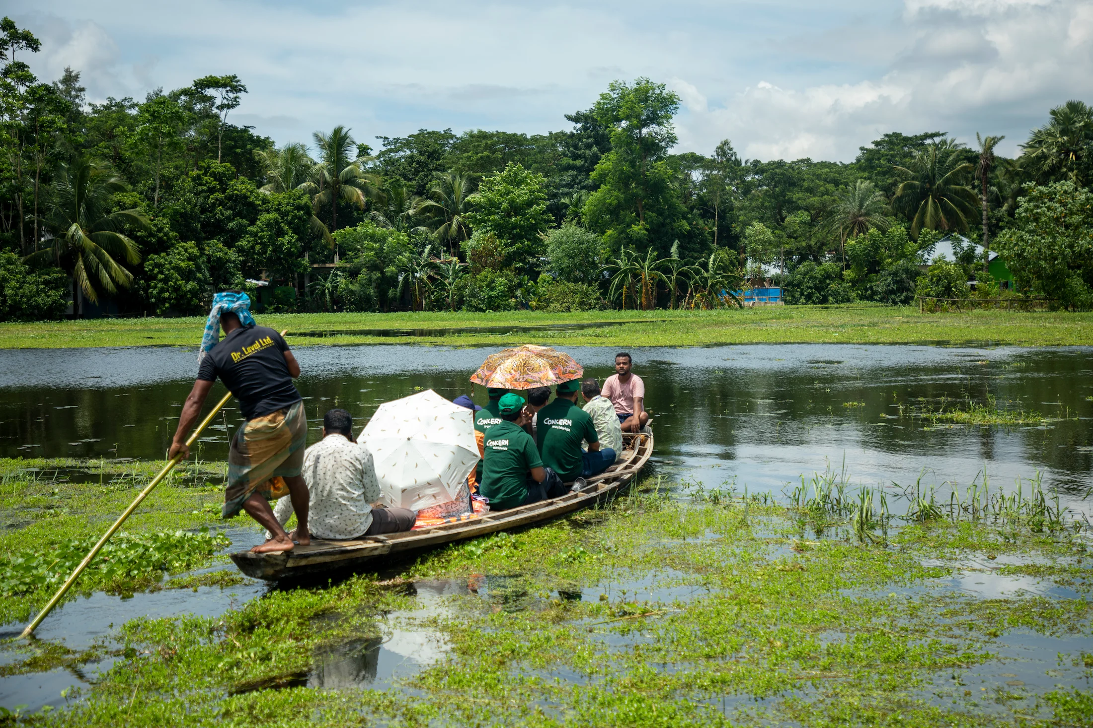 A small boat carrying several Concern Worldwide staff members.