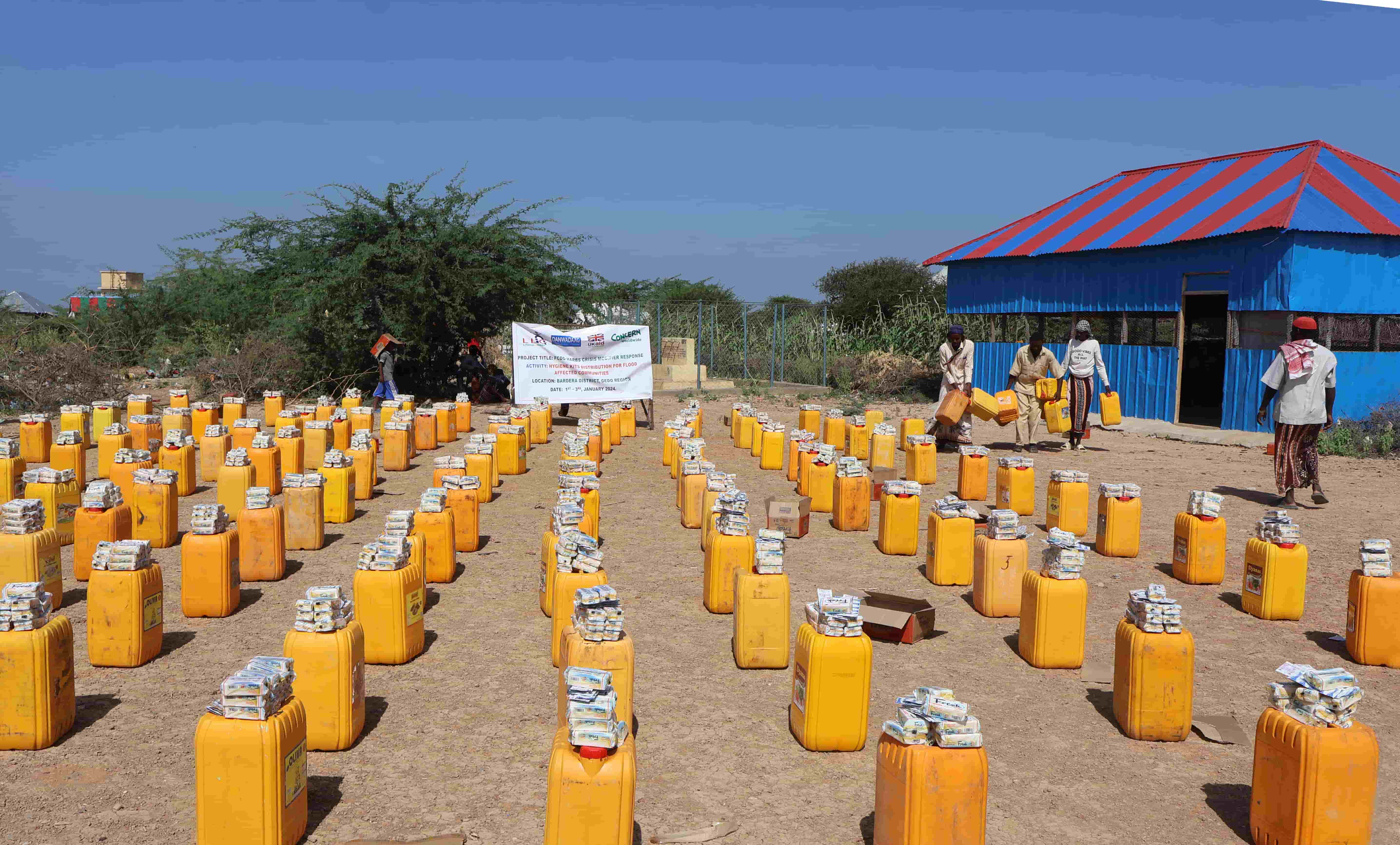 Rows of yellow columns with aid packets placed on top of them.