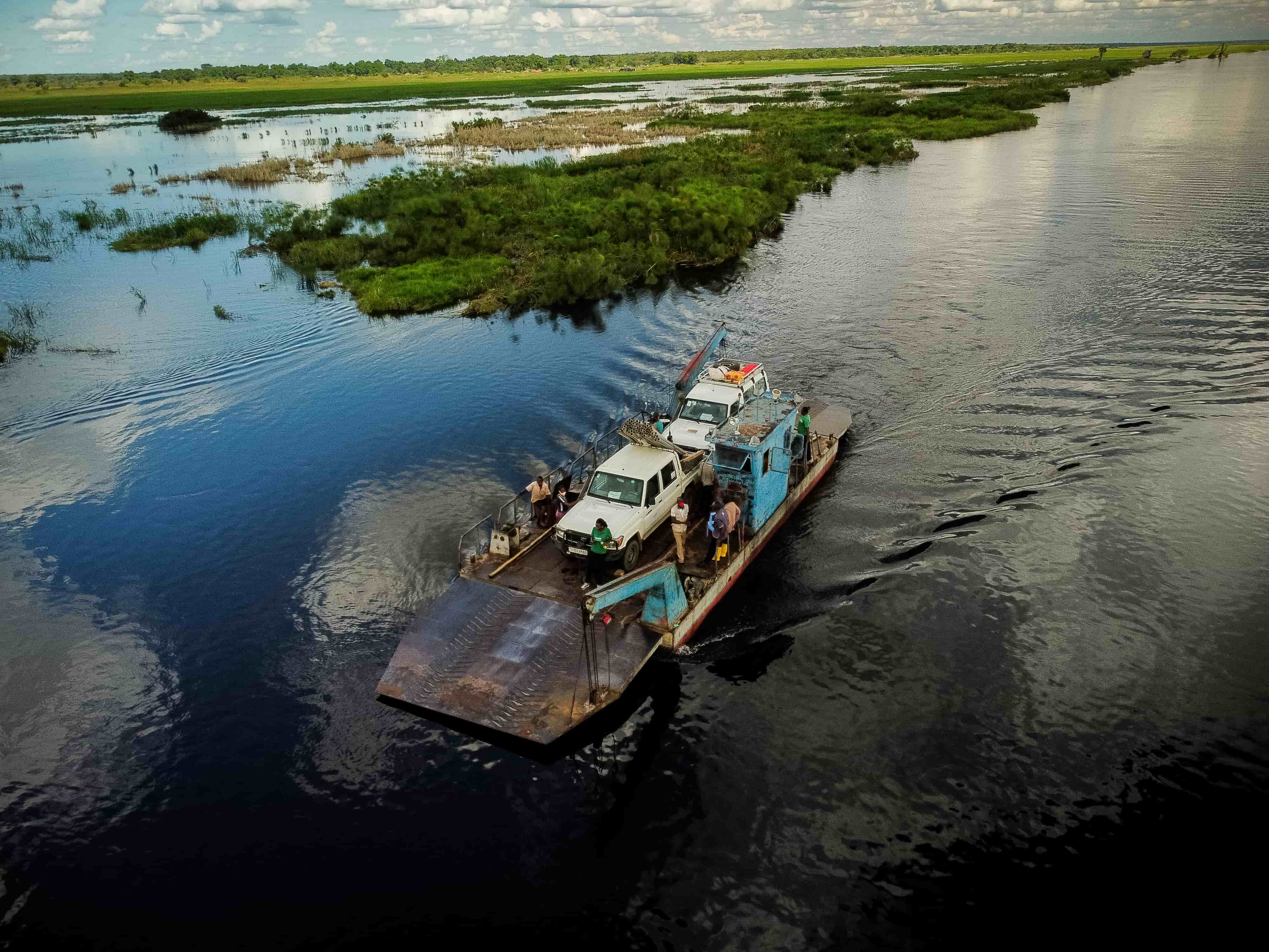 A barge transporting vehicles across a body of water